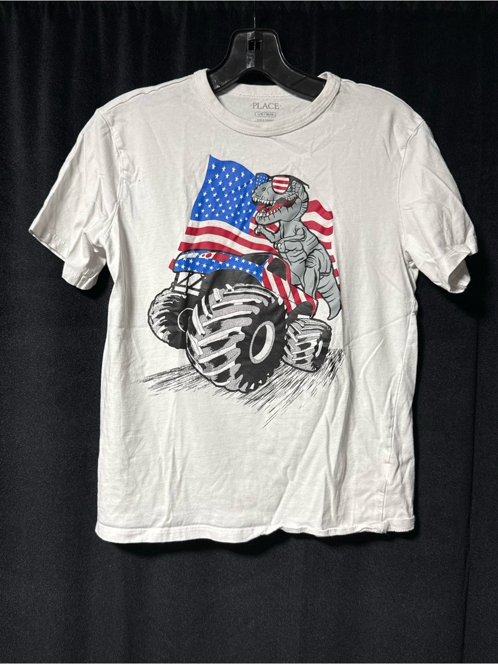 Place White Tee with Patriotic Dino on Monster Truck